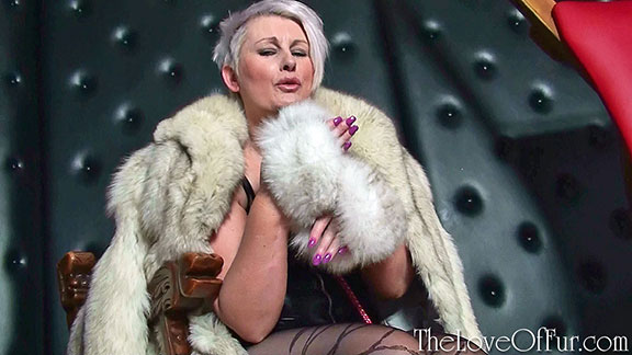 Milf mistress in fox fur coat fur handcuffs and stockings Sally Taylor
