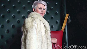Sexy Sally Taylor is your milf dominatrix in a blue fox fur coat